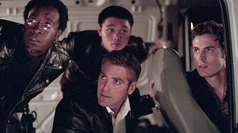 Don Cheadle, George Clooney, Shaobo Qin, and Casey Affleck in a scene from 2001's Ocean's Eleven.