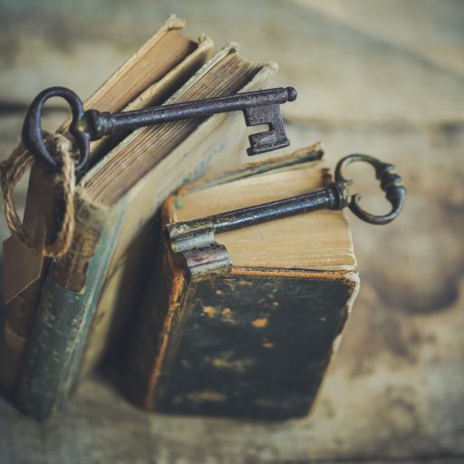 Books with keys set on top.