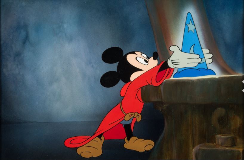 Mickey Mouse reaches for the magical hat in The Magician's Apprentice.