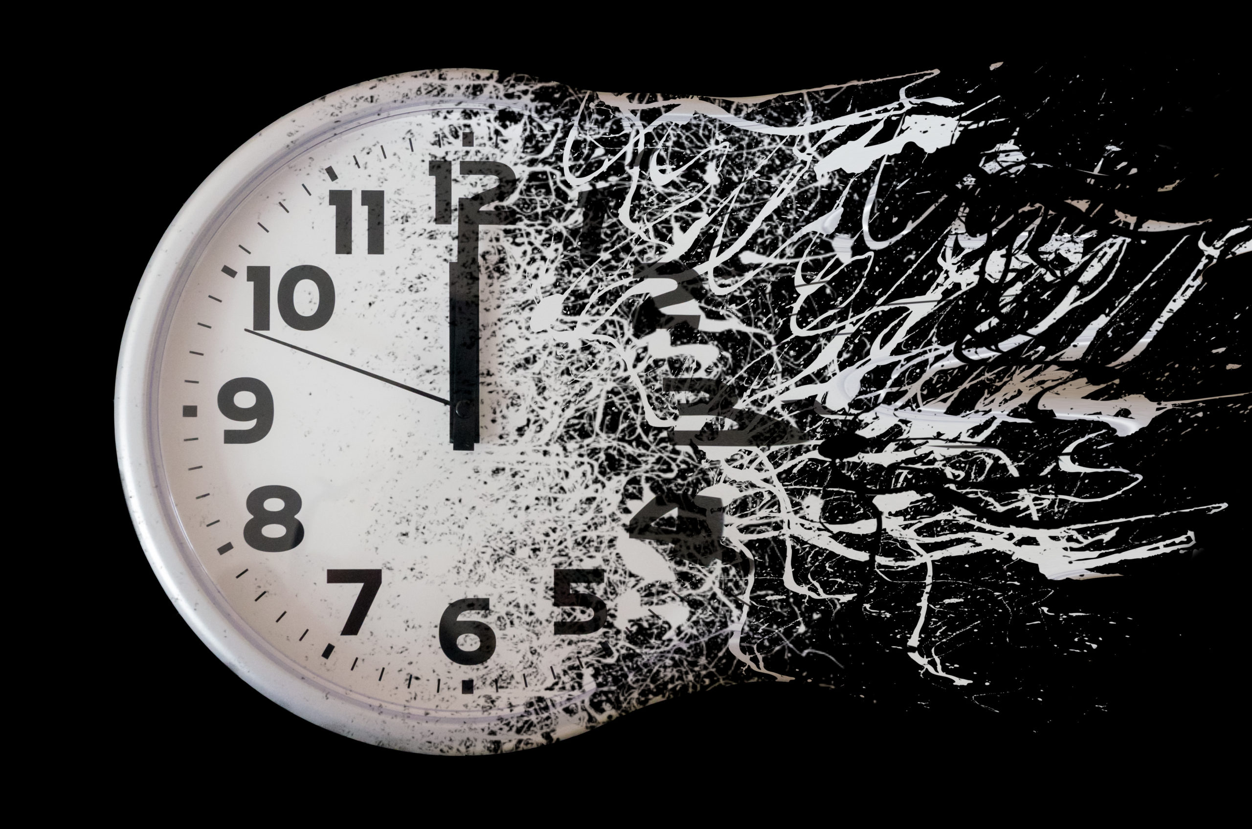 An analog clock dissolves against a black background.