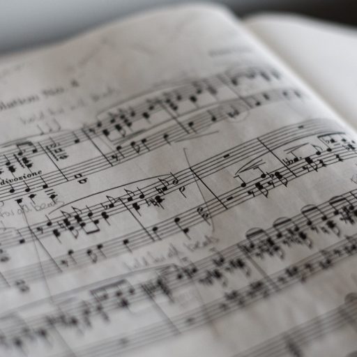 Sheet music up close illustrating how we can hear music from protein chains