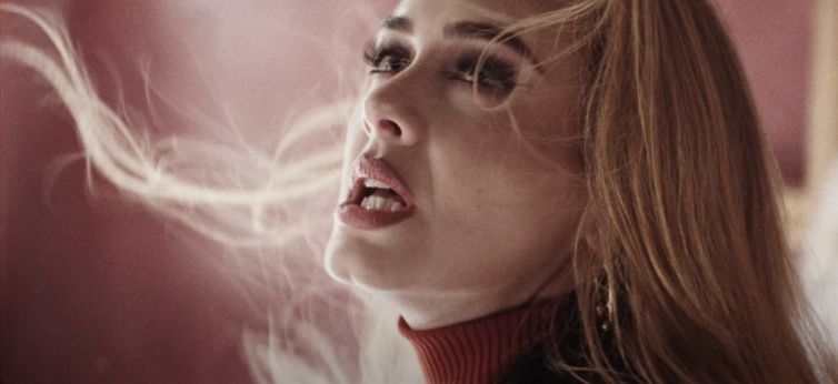 Adele singing; why sad songs make us feel good.