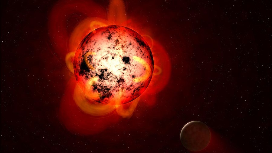 Caption:An illustration of a red dwarf star orbited by an exoplanet.