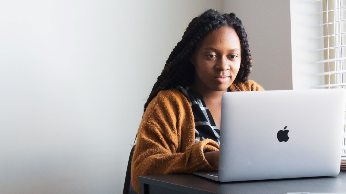 A woman doing therapy on her laptop