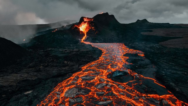 Lava pours out from a volcanic eruption.