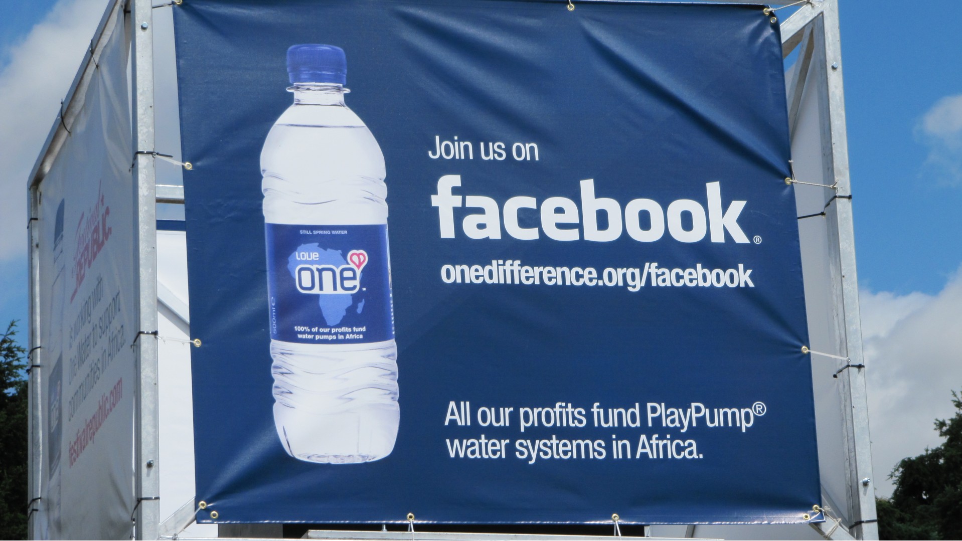 An advertisement for Facebook water bottles promoting PlayPump.