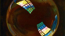 A close-up of a soap bubble reflecting bright, colorful windowpanes against a dark background.