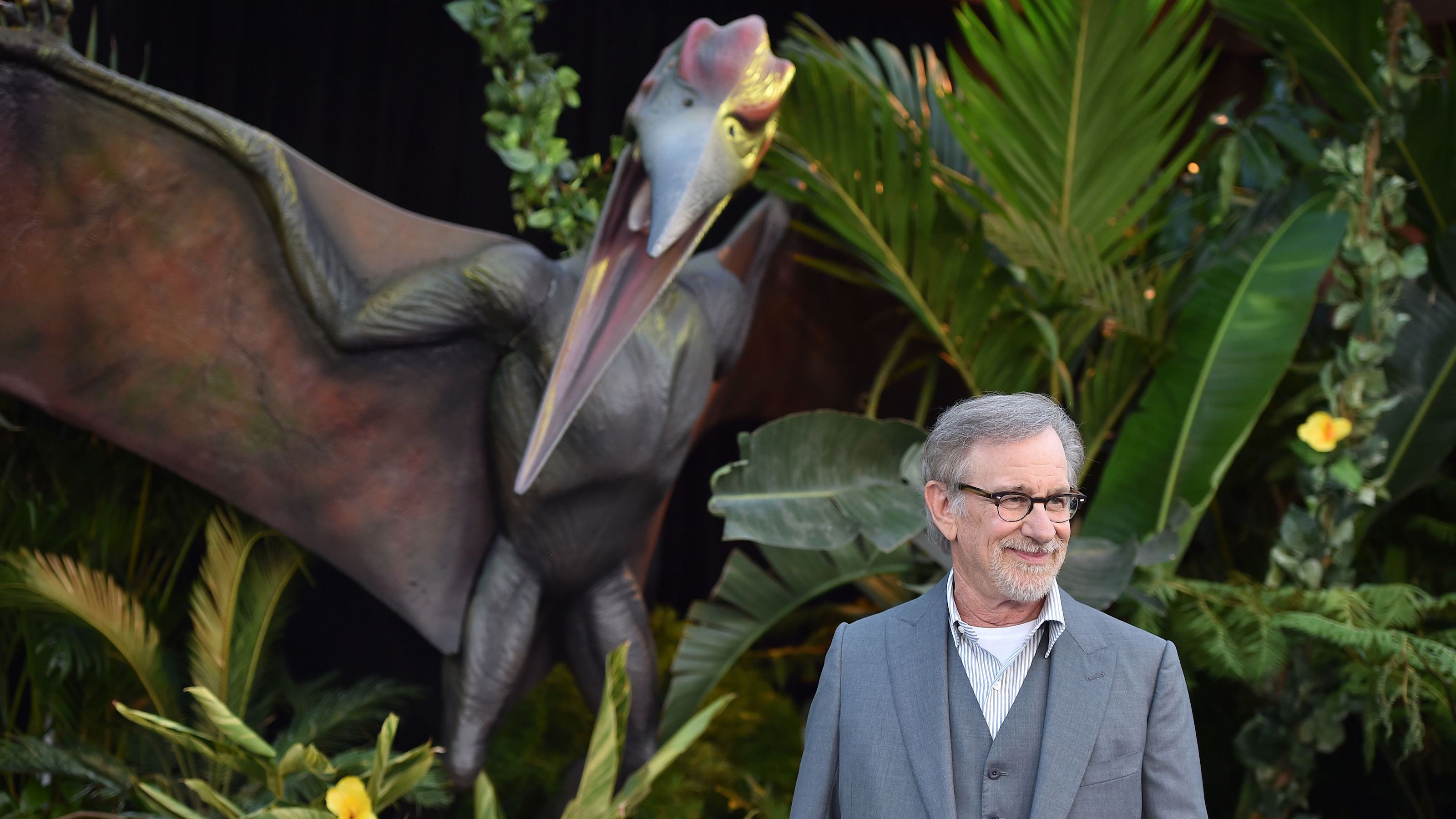 Steven Spielberg in front of a pterodactyl