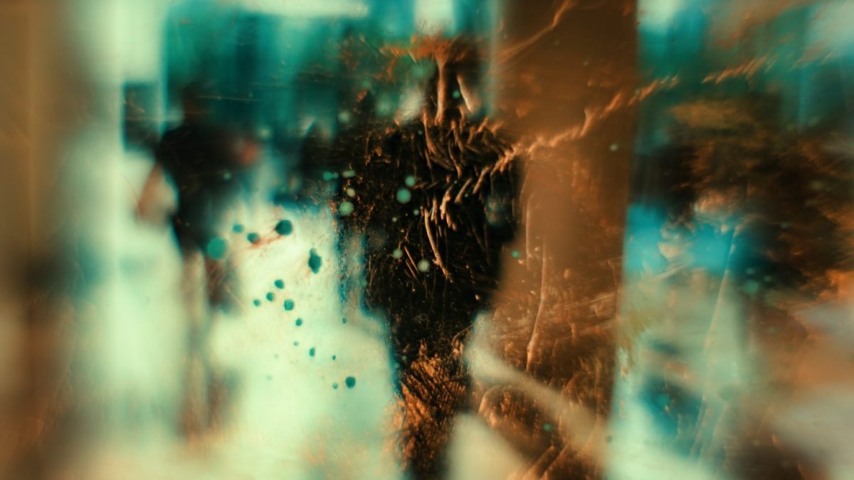 a blurry image of a person walking down a street.