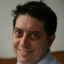 a close up of a person wearing a shirt and tie.