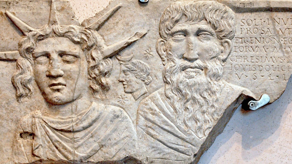 A close up of a carving on a wall showing Sol Invictus