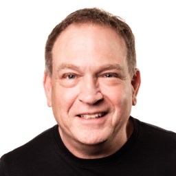 a close up of a person wearing a black shirt.