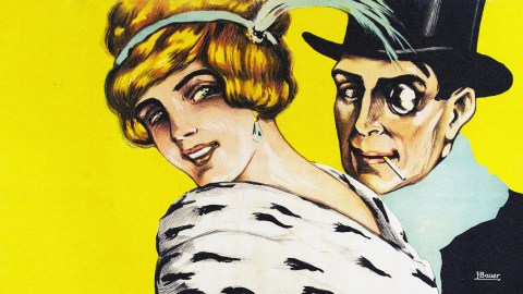 A man and woman in top hats explore Berlin nightclubs via pneumatic tubes.