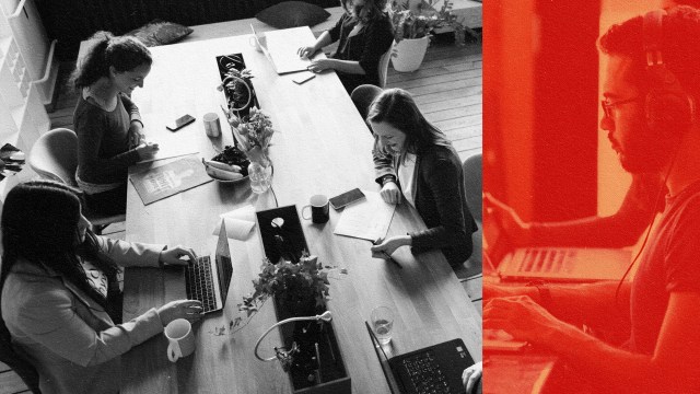 A group of people sitting at a table in a brave space, working on their laptops.