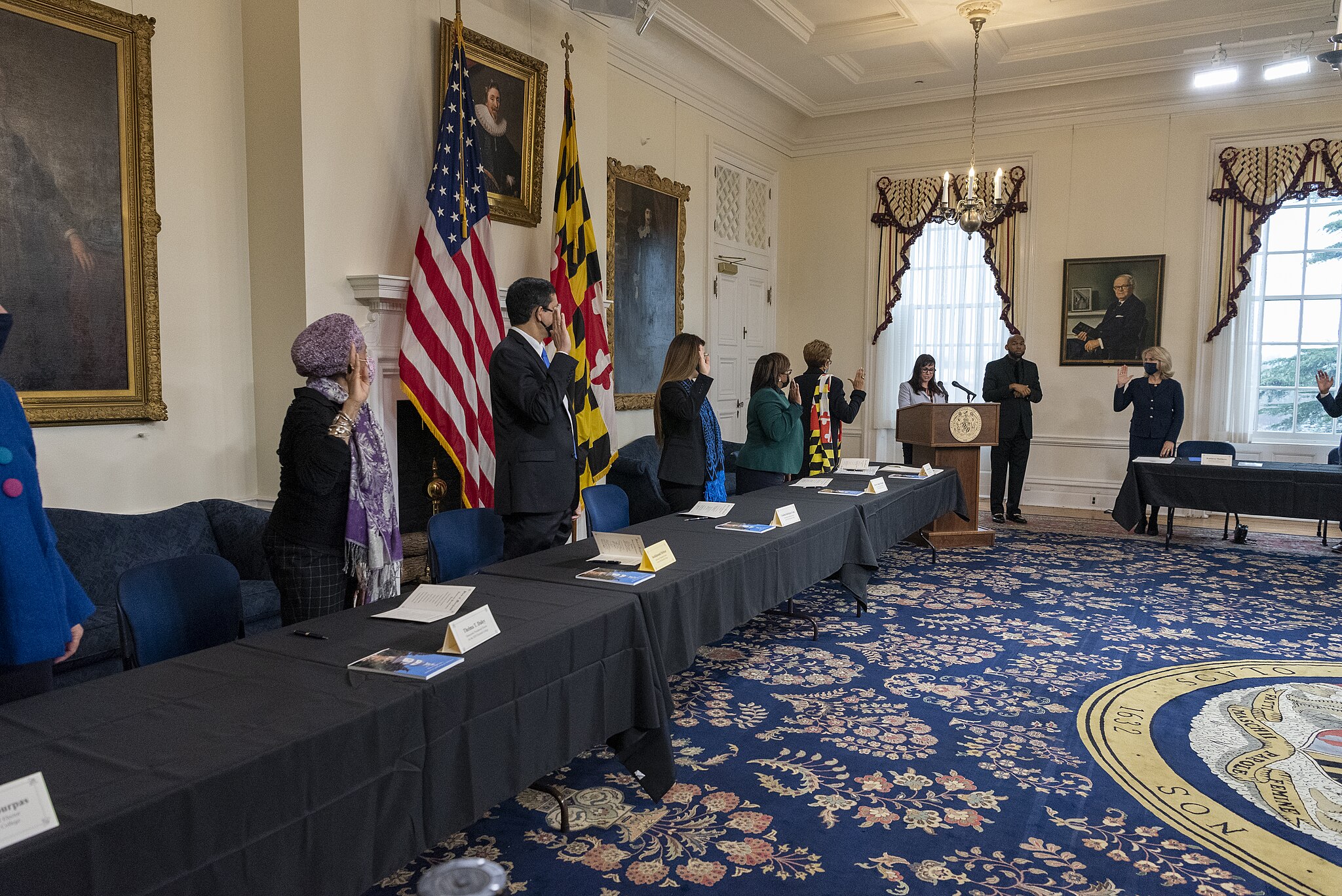 A group of people standing in a room.