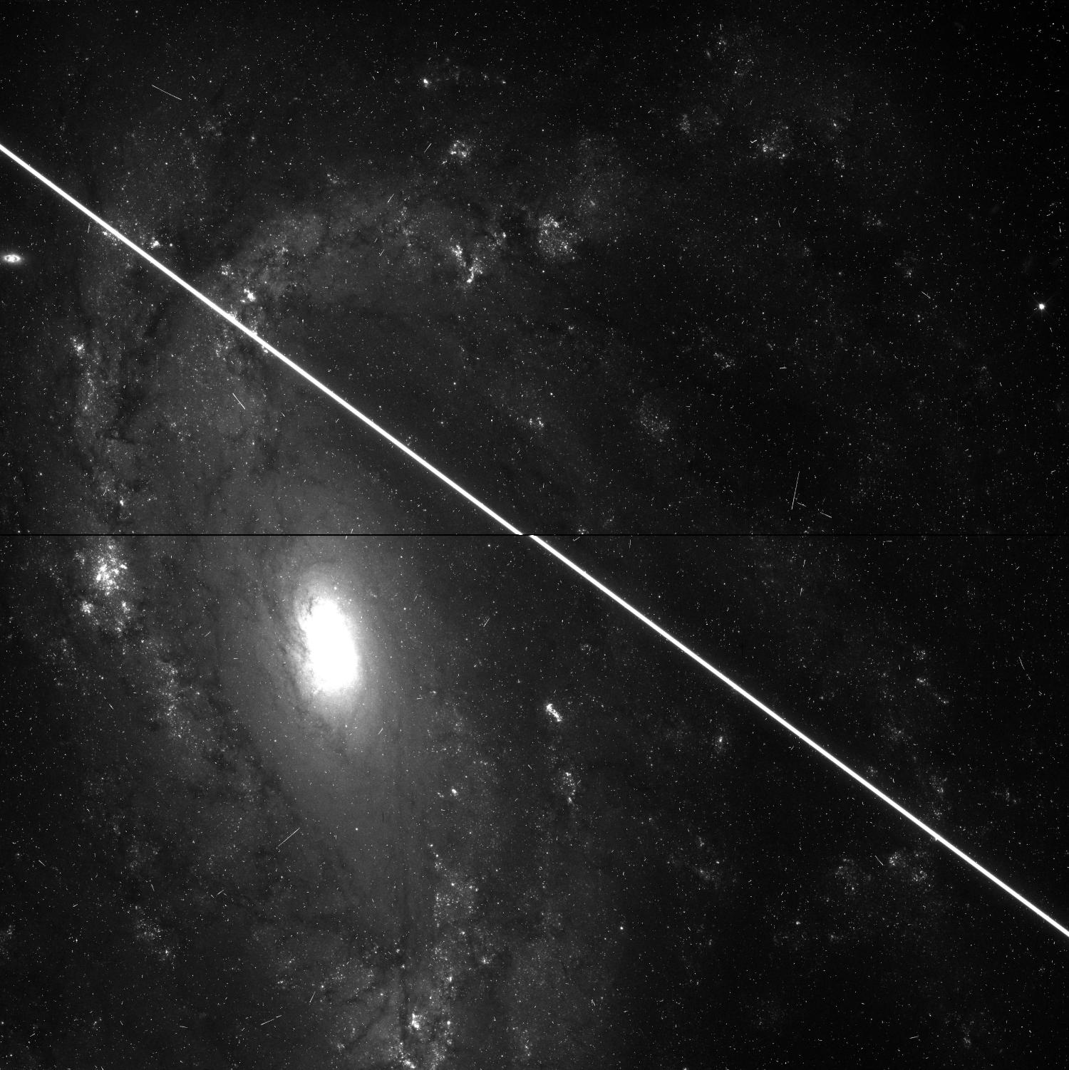 A black and white image of a galaxy with pollution.