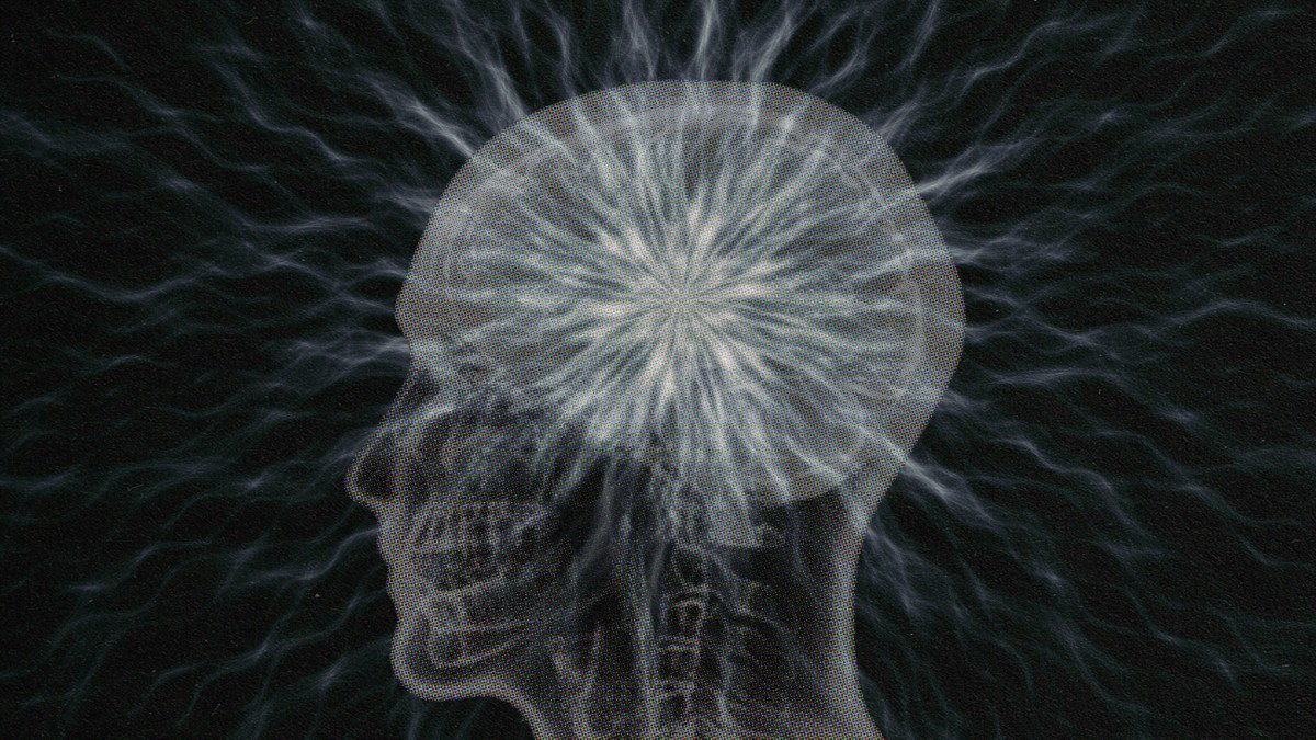 X-ray style image of a human head with brain highlighted by luminous, branching electric currents made of particles against a dark background.