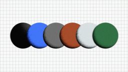 Five round, flat objects in black, blue, gray, red, and green are arranged in a row on a grid background.