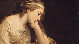 A young woman with long hair rests her head on her hand, eyes closed, wearing a loose white garment and a headband, against a dark background.