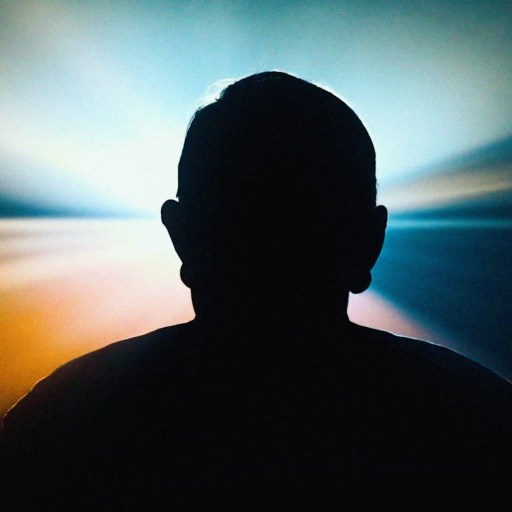 Silhouette of a person against a vibrant background with radiating light beams in blue, white, and orange hues.