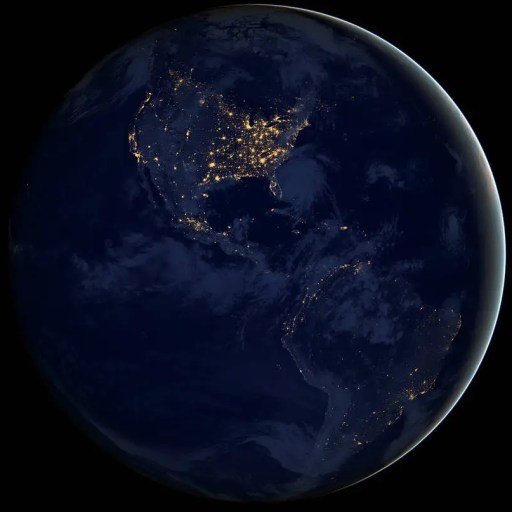 From the vastness of space, Earth at night reveals its exo-earth beauty, with illuminated continents showcasing a tapestry of lights across North and South America. Major cities and regions emerge from the glowing darkness, painting a vivid picture against the backdrop of oceans.