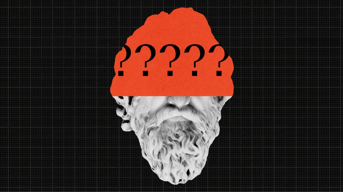 A stone bust of a bearded figure with an orange band across its forehead displaying several question marks.