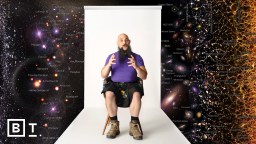 A person sits in front of a white backdrop, surrounded by a cosmic map with galaxies and celestial objects.