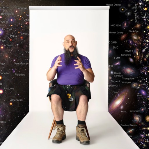 A person sits in front of a white backdrop, surrounded by a cosmic map with galaxies and celestial objects.