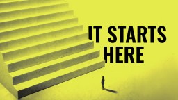 A small person stands at the base of a large staircase with the words "IT STARTS HERE" in bold black letters on a yellow background.