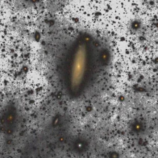 The spiral galaxy, surrounded by dim stars and interstellar dust, stands out against a dark background, shining brighter than astronomers once imagined.