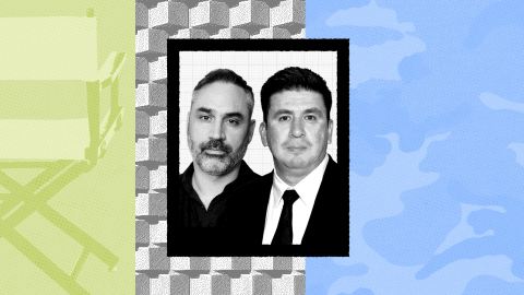 Two men pose for a formal portrait; one wears a dark shirt and the other a suit and tie, set against a patterned background evocative of Alex Garland’s visual style, divided into green, gray, and blue sections.