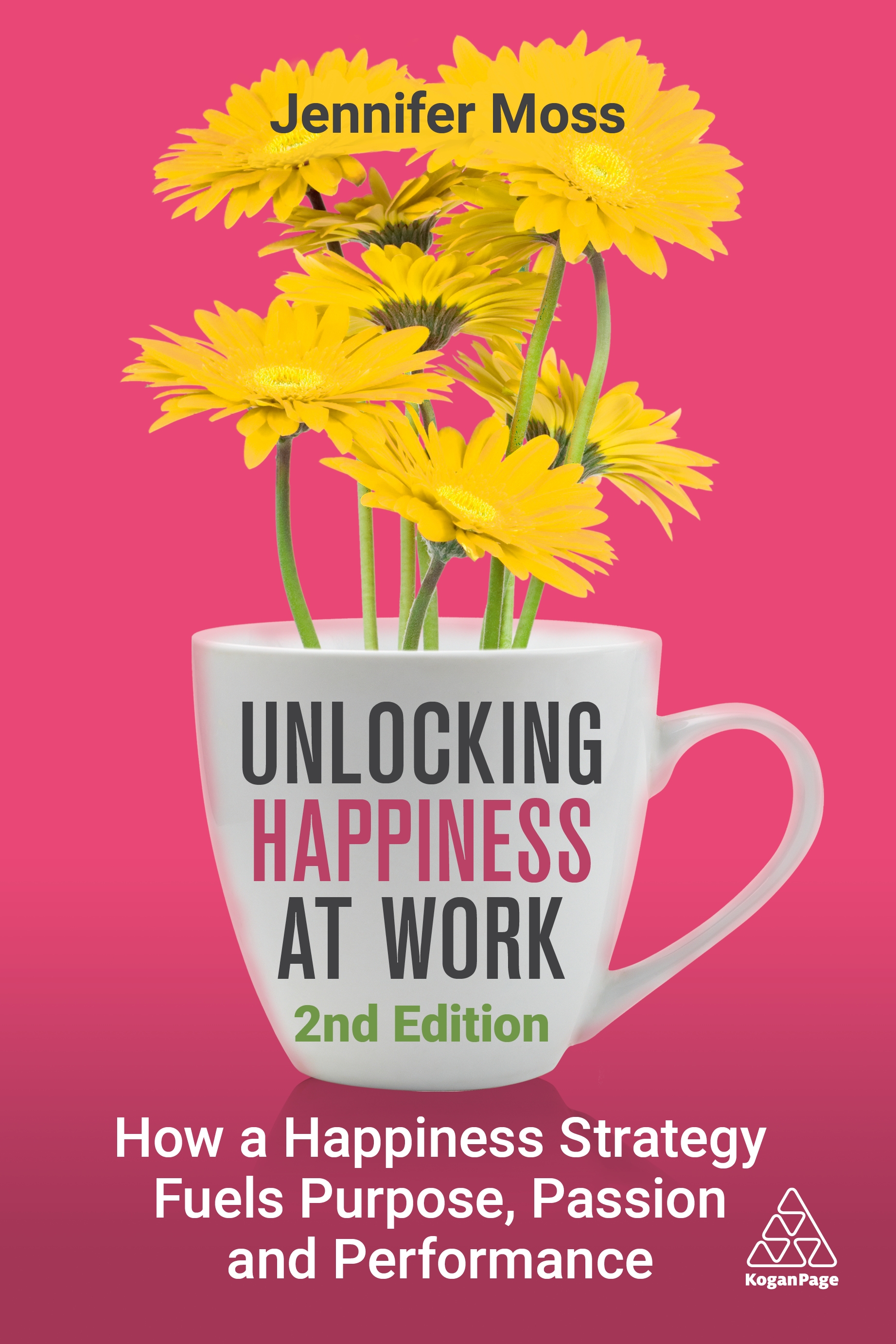 A white mug with yellow flowers displays the book title "Unlocking Happiness at Work" by Jennifer Moss, 2nd edition, with a tagline about happiness strategies in the workplace.