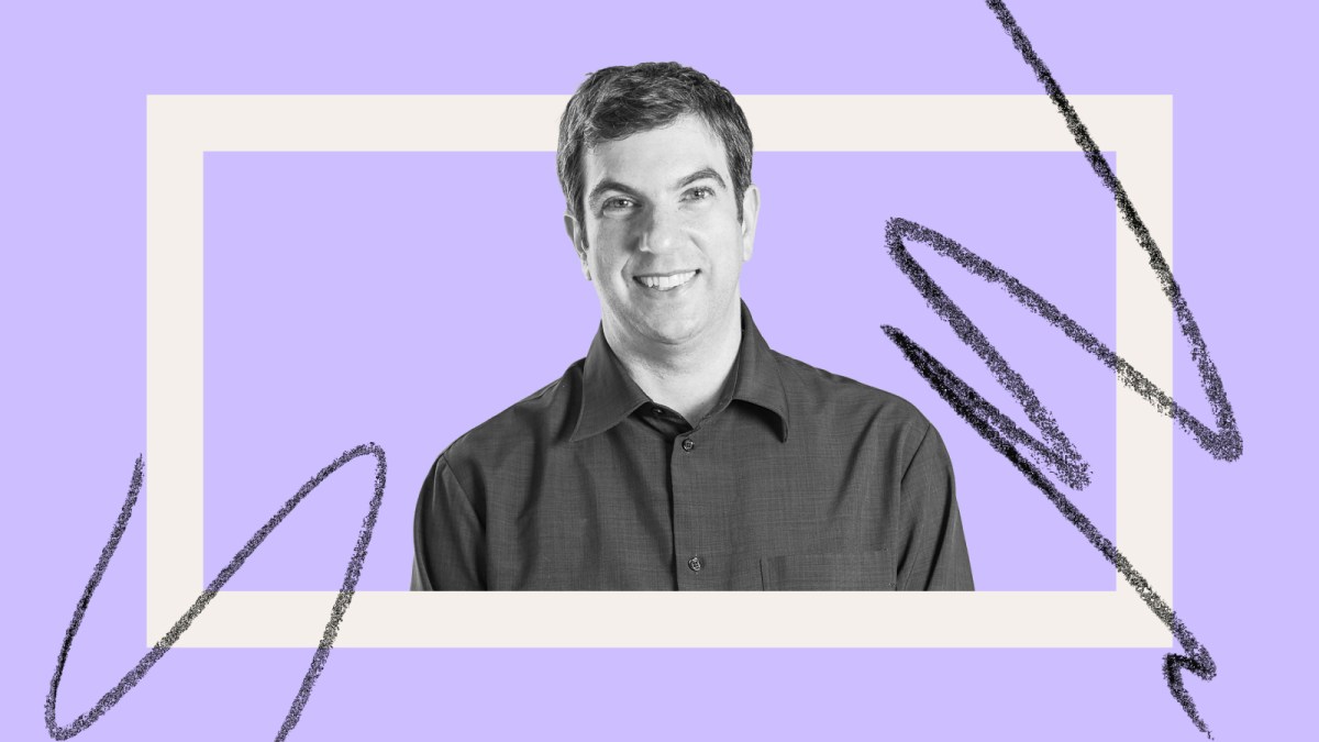 Man in a dark shirt smiling against a purple background with black scribbles and a white rectangle, reminiscent of "The Year of Living Biblically," embracing the chaos with serene humor.