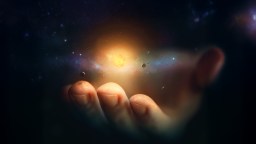 A human hand appears to hold a glowing celestial object surrounded by small planets and stars, creating the illusion of a miniature universe in the palm.
