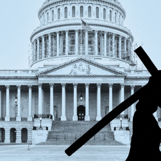 Silhouette of a person carrying a cross in front of the United States Capitol building, symbolizing cross purposes between faith and politics.