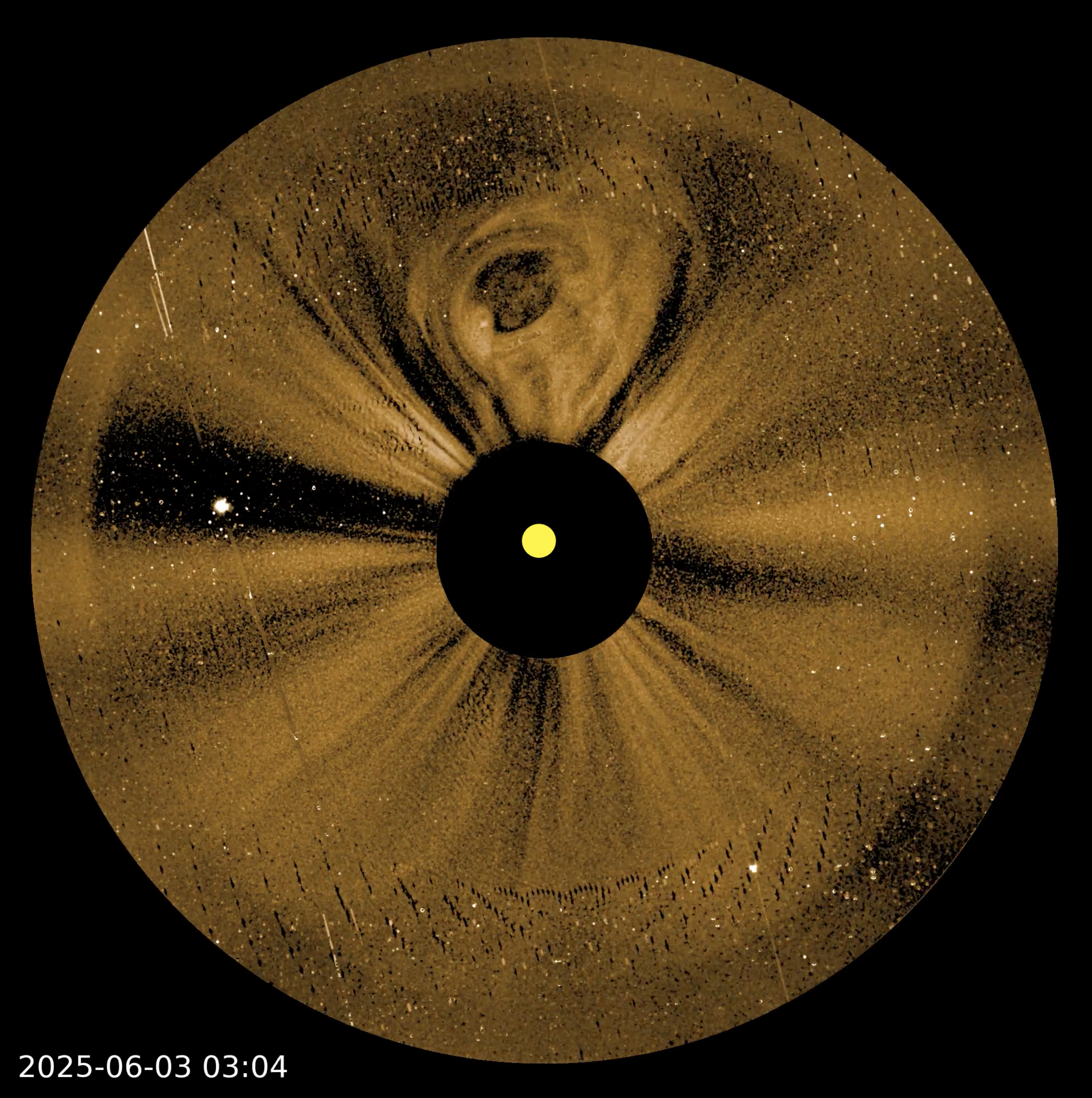 Circular solar observation image shows the sun at the center with bright and dark radial patterns, dated 2025-06-03 03:04, suggesting solar activity or coronal mass ejection—similar to imagery seen in NASA PUNCH video sun corona footage.