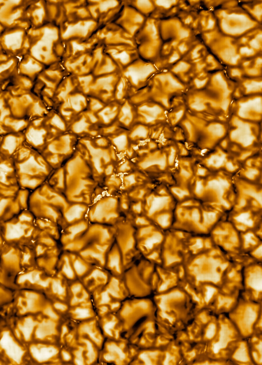 Close-up image of the Sun's surface shows a granular, textured pattern in shades of gold and brown, representing convection cells called granules—similar to those highlighted in recent NASA PUNCH video sun corona footage.