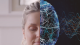 A split image showing the left half of a woman's face and the right half as a digital brain with neural connections and data waves.