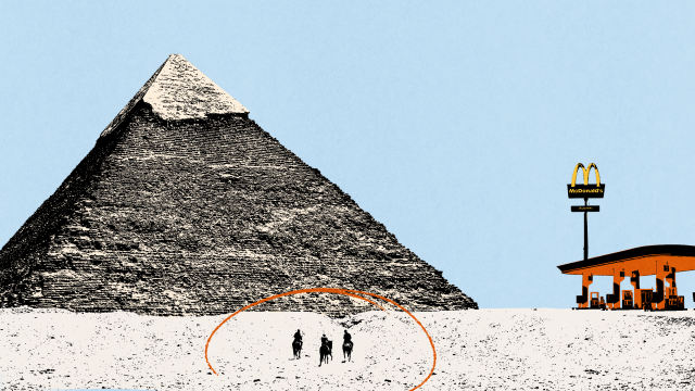 A pyramid stands in a desert with three people in front, evoking experimental archeology; a modern McDonald's restaurant is visible in the background on the right.
