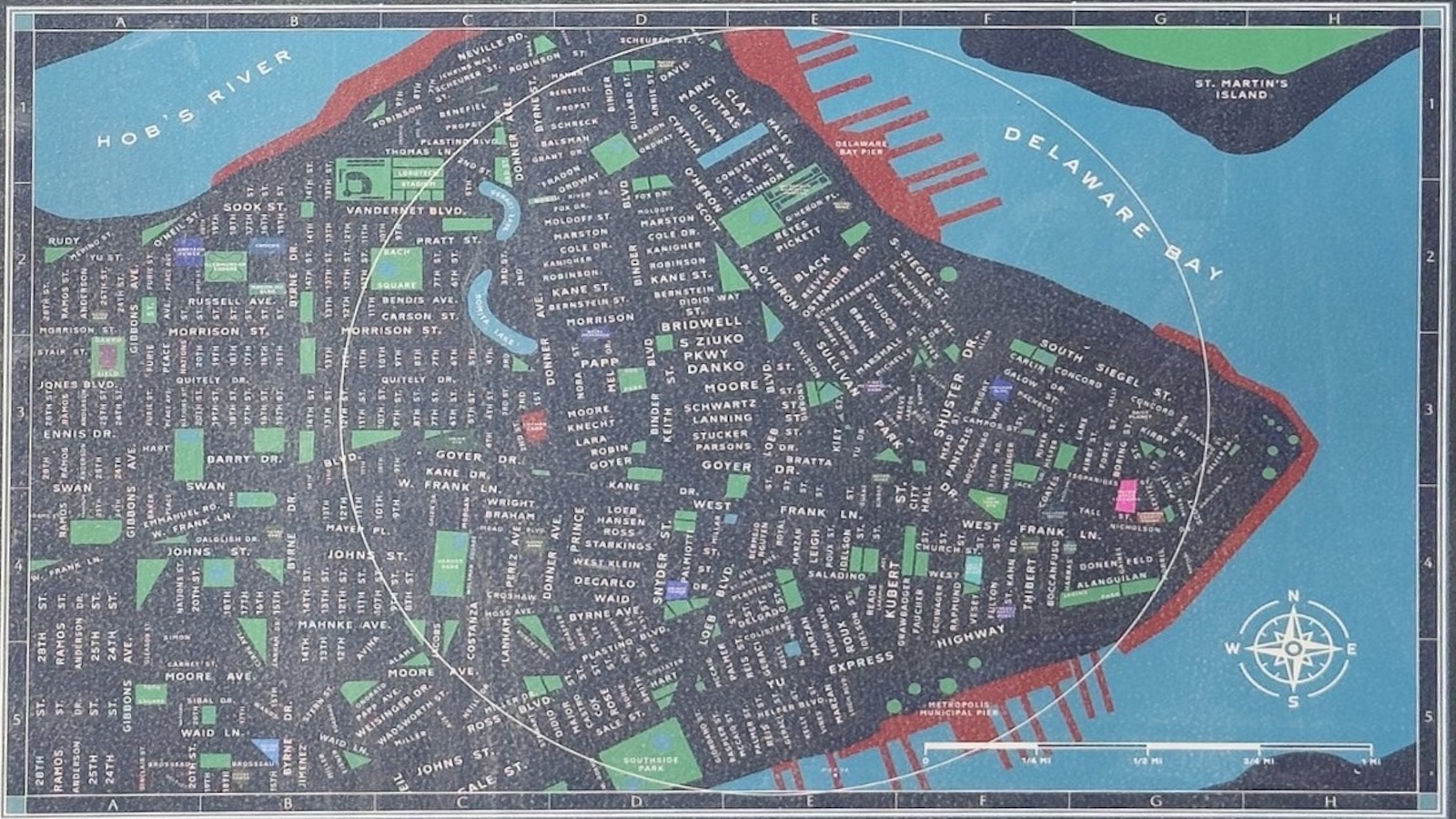 Illustrated map showing streets, parks, and landmarks of a coastal city bordered by Hob's River and Delaware Bay, with a compass rose in the lower right corner.