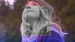 A person with long blonde hair wearing a beanie and plaid jacket looks upward outdoors; a transparent geometric square overlay is centered on the image.