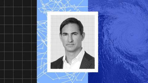 Black-and-white portrait of a man in a suit centered between a grid, network lines, and a swirling blue pattern evoking a hurricane, symbolizing the dynamic power of predictive intelligence.