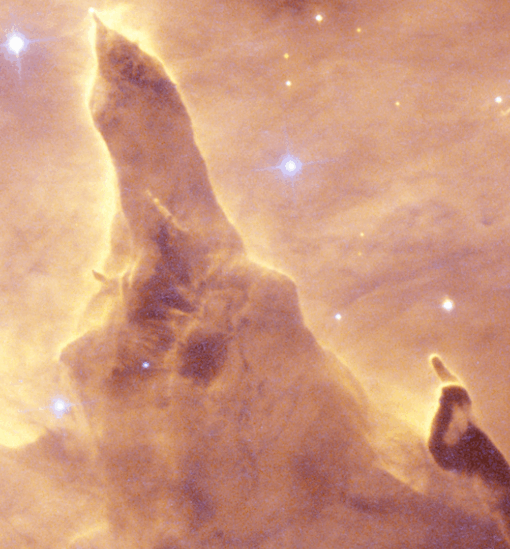 Close-up image of a pillar-shaped cloud of gas and dust in space, with bright stars shining in the background—captured by both JWST and Hubble near the star cluster Pismis 24.