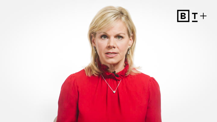 A woman with blond hair wearing a red blouse sits in front of a white background with a "B T +" logo in the top right corner.