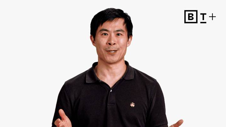 A man in a black polo shirt stands against a plain white background with the BT+ logo in the top right corner.