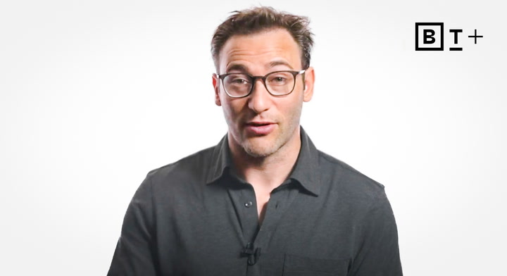 A man with glasses and short hair wears a dark shirt and faces the camera against a plain white background with a "B T+" logo in the upper right corner.