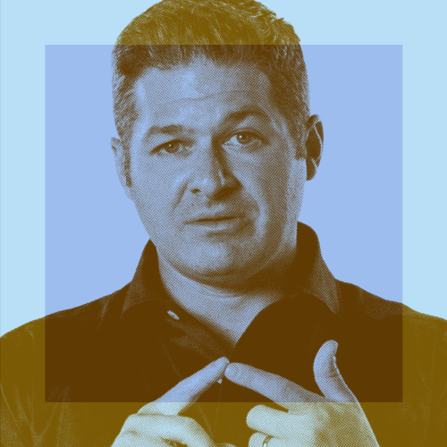 A man with short hair in a collared shirt gestures with his hands, pointing toward himself, against a blue background with translucent color overlays.