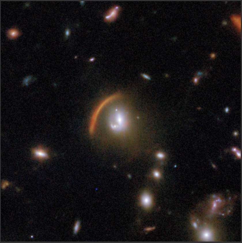 Several galaxies and a prominent red-orange arc of light, likely caused by a gravitational lens, are visible against a dark background in deep space—an image captured by the COSMOS-Web project using the JWST.
